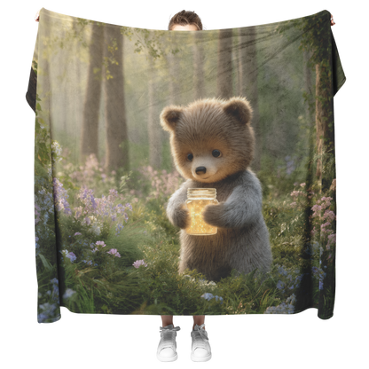 Baby_Bear_Holding_Glowing_Honey_Jar_In_P_H_Blanket_Model_Mockup.png