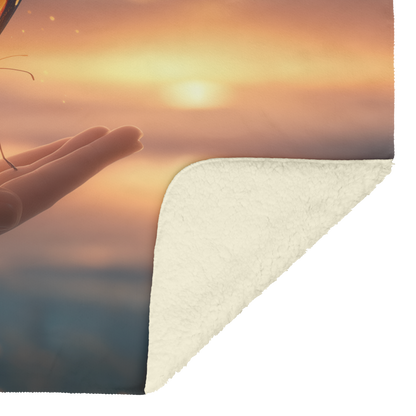Bright_Butterfly_Resting_On_Hand_Extende_H_Blanket_Sherpa_Mockup.png
