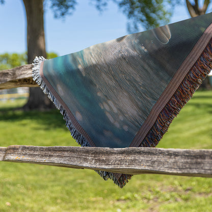 Dolphins Leaping in Sunlit Lagoon  Stunning Tropical Wildlife Art with Lush Greenery and Majestic Mountains  Woven Throw Blanket for Home or Office Decor - Awakening Righteousness
