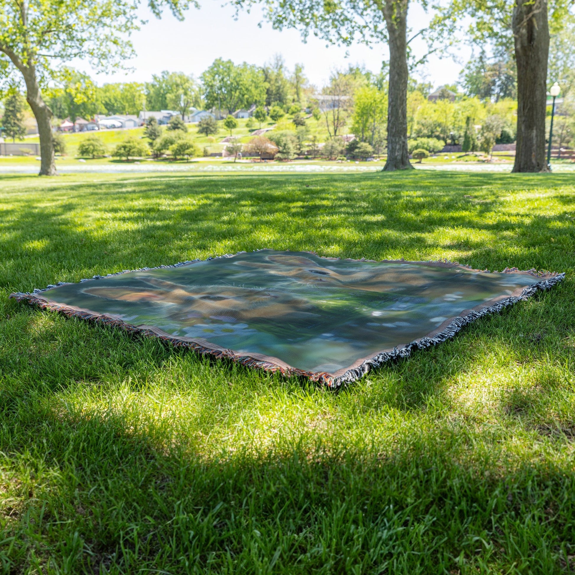 Two Rabbits Sitting by Glowing Crystal Clear Pond Woven Throw Blanket with Green Grass and Wildflowers Under Twilight Sky - Awakening Righteousness